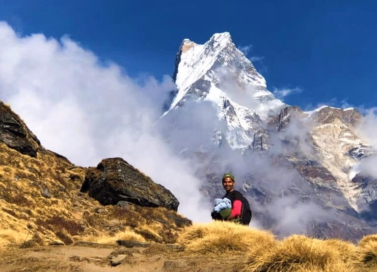 A trekking guide in front of Mardi Himal, i.e Machhapuchhre mountain