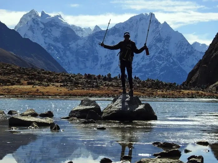 Two visitors enjoying view of Gokyo Lake