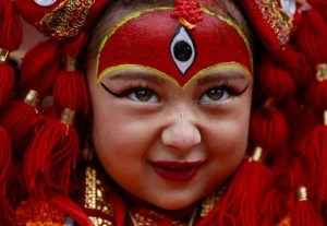 A young girl dressed as the Living Goddess Kumari takes part in the Kumari Puja festival,
