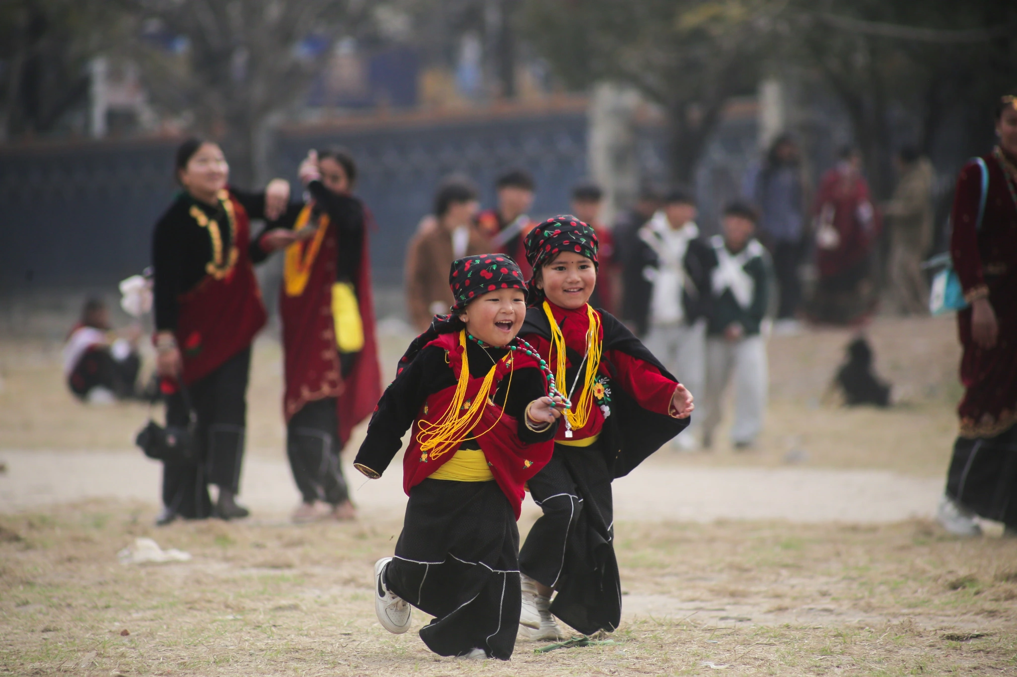 childrena playing aroundin traditional magar dress