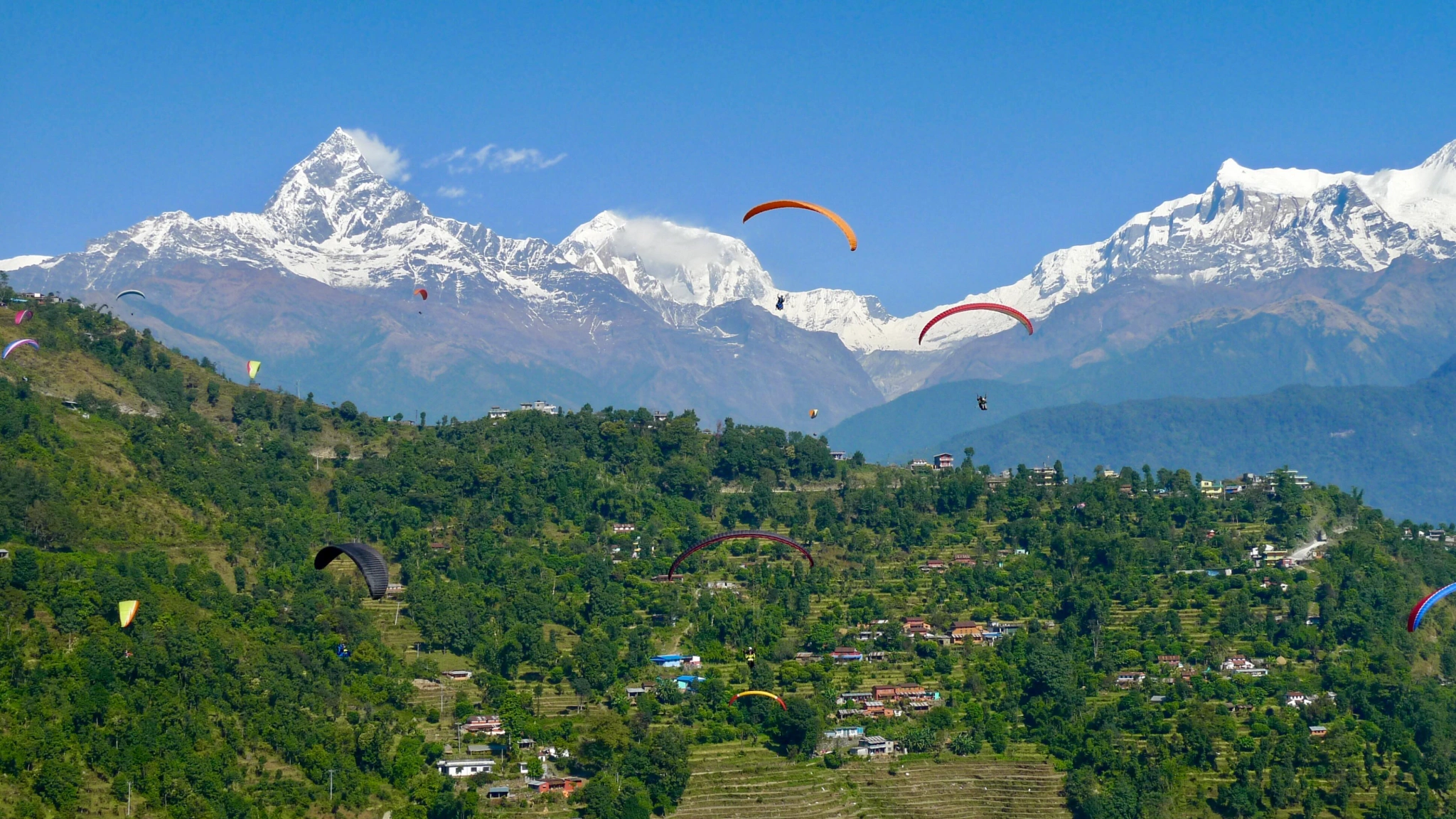 group-of-people-enjoying-the-view-of-pokhara-while-paragliding.webp