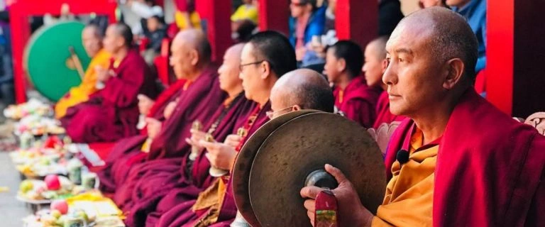 Monks doing fire puja in Mani Rimdu festival