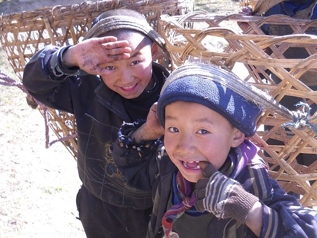 Sherpa children carrying Doko, a traditional basket