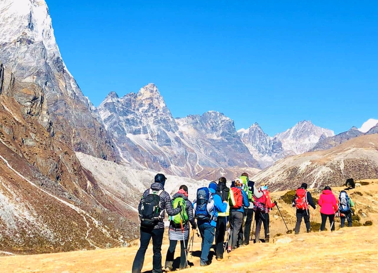 Trekkers walking toward base camp